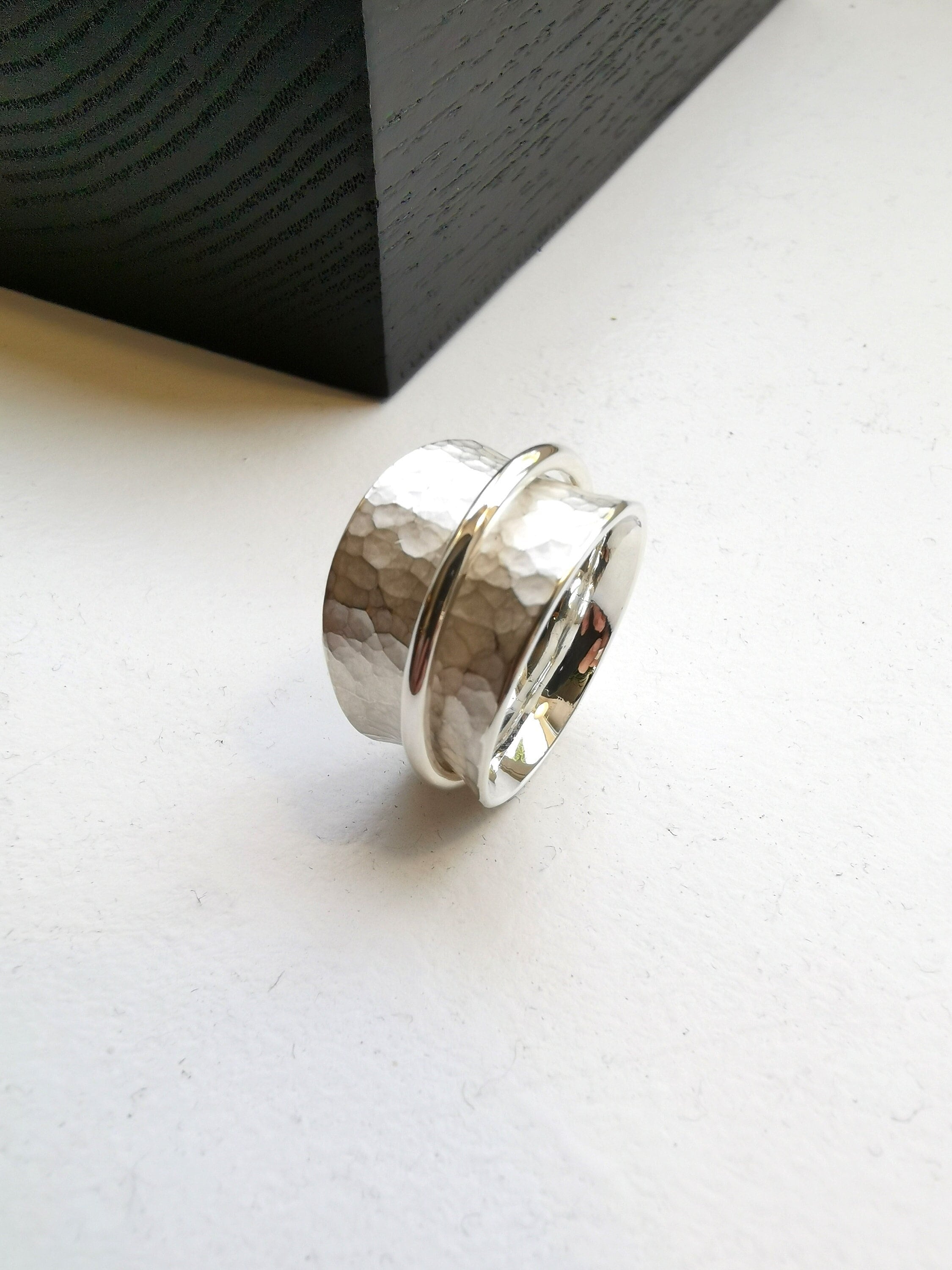 Hammered silver spinner ring with polished band